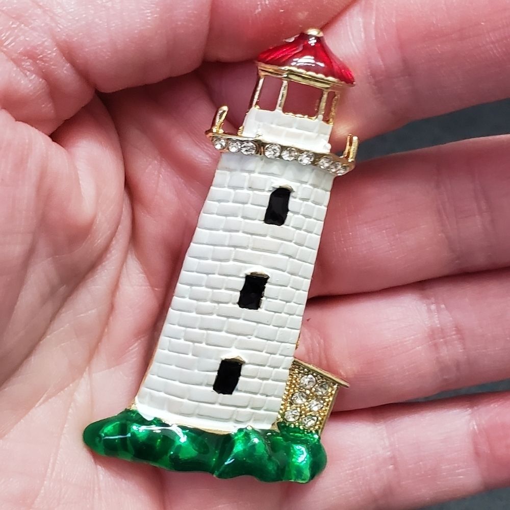 Gold tone white lighthouse brooch